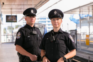 Two Officers standing on the SkyTrain Platform