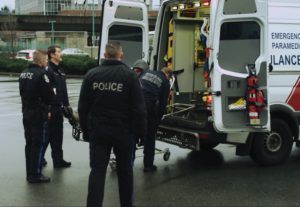 Image of Ambulance and Officers