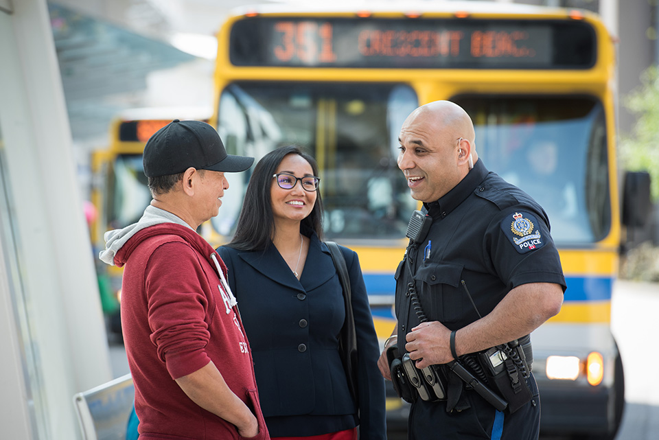 Transit Police Officer Engaging with Passengers